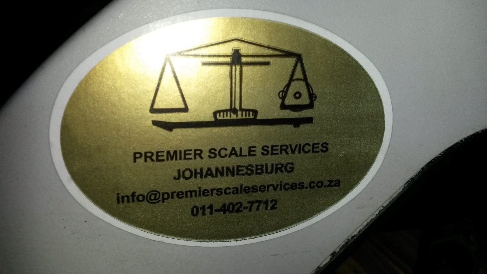 Premier Scale Services verification seal on a calibrated scale